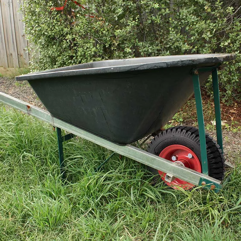 Steel centred pneumatic wheel fitted a wheelbarrow